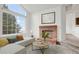 Bright living room with fireplace and large windows at 4760 S Wadsworth Blvd # G304, Littleton, CO 80123