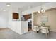 Bright living room with open layout to the kitchen and modern lighting at 4760 S Wadsworth Blvd # G304, Littleton, CO 80123