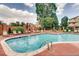 Large community pool with lounge chairs and patio tables perfect for relaxing and entertaining at 4760 S Wadsworth Blvd # G304, Littleton, CO 80123