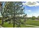 Scenic view of a ball field with lush green grass and trees, offering a recreational space at 6328 E Mississippi Ave, Denver, CO 80224