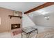 Basement featuring a decorative brick fireplace and carpeted floors at 6328 E Mississippi Ave, Denver, CO 80224