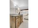 Finished basement with a bathroom with wood vanity at 6328 E Mississippi Ave, Denver, CO 80224