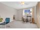 Bright bedroom with window, sheer curtains, carpet, closet, and desk at 6328 E Mississippi Ave, Denver, CO 80224