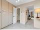 Hallway featuring tile floors, with views to other rooms in the house at 6328 E Mississippi Ave, Denver, CO 80224
