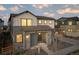 Charming exterior with stone accents, inviting porch, and well-manicured landscaping at 23721 E 40Th Ave, Aurora, CO 80019