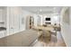 Spacious living area with cozy fireplace, TV, and seamless access to the kitchen at 23721 E 40Th Ave, Aurora, CO 80019