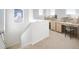 Bright loft area featuring built-in desk and shelving, with natural light at 23721 E 40Th Ave, Aurora, CO 80019