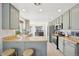 Bright kitchen with stainless steel appliances, wood counters, and light green cabinets at 2490 S Jebel Way, Aurora, CO 80013