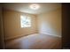Bright bedroom with natural light, featuring wood-look floors and neutral walls at 1552 S Fairplay Way, Aurora, CO 80012
