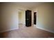 Bedroom with closet, wood-look floors, and access to the hallway at 1552 S Fairplay Way, Aurora, CO 80012