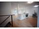 Modern kitchen island with quartz countertops and stainless steel appliances, seamlessly blending with living area at 1552 S Fairplay Way, Aurora, CO 80012