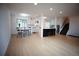 Expansive open floor plan showcasing the kitchen, dining area, and living space with contemporary finishes at 1552 S Fairplay Way, Aurora, CO 80012