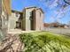 Inviting backyard with green grass, partial fence, and the exterior of the home at 2245 Whistler Dr, Longmont, CO 80504