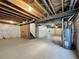 Unfinished basement with exposed ceiling, concrete floor, and ample space at 2245 Whistler Dr, Longmont, CO 80504