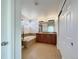 Well-lit bathroom featuring a soaking tub, double vanity, and tile flooring at 2245 Whistler Dr, Longmont, CO 80504