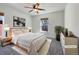 Cozy bedroom with plush carpet, large window, and soft, neutral furnishings at 2245 Whistler Dr, Longmont, CO 80504