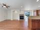 Spacious living room featuring a fireplace, open layout, and a convenient kitchen island at 2245 Whistler Dr, Longmont, CO 80504
