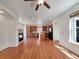 Spacious living room with hardwood floors, fireplace, and open layout to the modern kitchen at 2245 Whistler Dr, Longmont, CO 80504