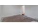 Unfinished basement with neutral walls and a door to another room at 950 S Leyden St, Denver, CO 80224