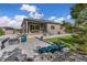 Spacious backyard with a large patio, fire pit, and water feature at 4213 Hickory Oaks St, Castle Rock, CO 80104