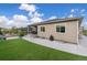 The backyard features a covered patio, artificial turf, and views of the surrounding hillsides at 4213 Hickory Oaks St, Castle Rock, CO 80104