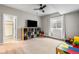 Versatile basement space featuring a TV, built-in shelving, and a window, ideal for a playroom or entertainment area at 4213 Hickory Oaks St, Castle Rock, CO 80104