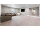 Relaxing basement living room with comfortable seating, a TV, and plenty of space for recreation at 4213 Hickory Oaks St, Castle Rock, CO 80104