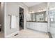 The bathroom features an access to walk-in closet, a double vanity, and walk-in shower at 4213 Hickory Oaks St, Castle Rock, CO 80104
