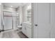 Bathroom features a glass shower, light wood flooring, and a modern vanity at 4213 Hickory Oaks St, Castle Rock, CO 80104