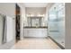 Bright bathroom features a walk-in shower, double vanity, and access to a large walk-in closet at 4213 Hickory Oaks St, Castle Rock, CO 80104