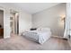 Bedroom featuring gray walls, a plush bed, and a decorative floor lamp at 4213 Hickory Oaks St, Castle Rock, CO 80104