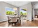 Charming dining room with large windows, ample natural light, and sliding door access at 4213 Hickory Oaks St, Castle Rock, CO 80104