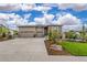 Beautiful home with a three-car garage, stone accents, professional landscaping, and a well-manicured lawn at 4213 Hickory Oaks St, Castle Rock, CO 80104