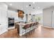 Well-equipped kitchen featuring stainless steel appliances and a large island with seating at 4213 Hickory Oaks St, Castle Rock, CO 80104