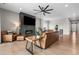 Open living room boasts a fireplace, large screen TV, and stylish modern furniture at 4213 Hickory Oaks St, Castle Rock, CO 80104