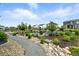 Backyard with fire pit, surrounded by comfortable seating and beautiful landscaping for outdoor relaxation at 5417 Riverbend Ave, Firestone, CO 80504