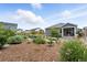 Landscaped backyard with a cozy patio area, perfect for relaxing and entertaining outdoors at 5417 Riverbend Ave, Firestone, CO 80504