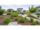 Serene backyard featuring lush landscaping and a cozy fire pit area for outdoor enjoyment at 5417 Riverbend Ave, Firestone, CO 80504