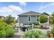Backyard fire pit area with comfortable seating and serene landscaping, ideal for outdoor gatherings at 5417 Riverbend Ave, Firestone, CO 80504