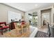 Well-lit dining area featuring backyard access and hardwood floors at 5417 Riverbend Ave, Firestone, CO 80504