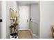 Inviting entryway with hardwood floors, neutral paint, and a decorative table at 5417 Riverbend Ave, Firestone, CO 80504