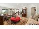 Open-concept living room featuring hardwood floors, light-colored walls, and backyard access at 5417 Riverbend Ave, Firestone, CO 80504