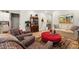 Open-concept living room featuring hardwood floors, light-colored walls, and comfortable seating at 5417 Riverbend Ave, Firestone, CO 80504