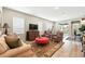 Bright living room with neutral tones, backyard access, and comfortable seating at 5417 Riverbend Ave, Firestone, CO 80504
