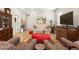Comfortable living room featuring hardwood floors, a couch, and stylish decor at 5417 Riverbend Ave, Firestone, CO 80504