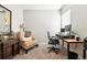 Cozy office with desk, chair, and lounge chair for a productive workspace at 5417 Riverbend Ave, Firestone, CO 80504