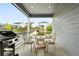 Outdoor patio area featuring table, chairs, and a grill perfect for backyard gatherings and summer barbecues at 5417 Riverbend Ave, Firestone, CO 80504