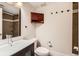 This bathroom has a floating vanity, an overhead cabinet, and a shower/tub combo at 740 N Sherman St # 107, Denver, CO 80203
