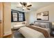 Bedroom with a comfortable bed, chaise lounge, and hardwood floors at 740 N Sherman St # 107, Denver, CO 80203