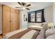 Cozy bedroom featuring a comfortable bed, wardrobe, and chaise lounge at 740 N Sherman St # 107, Denver, CO 80203